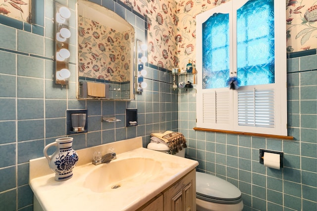 400 Selborne Rd, Riverside, IL 60546 - half bath featuring tile walls, vanity, and wallpapered walls