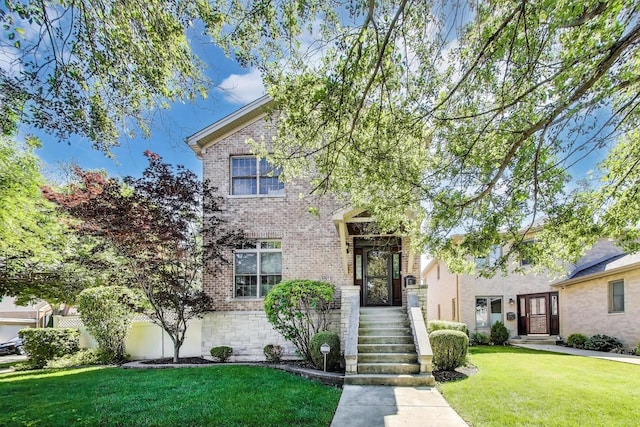 6067 N Oconto Ave, Chicago, IL 60631 - view of front of property with brick siding and a front lawn