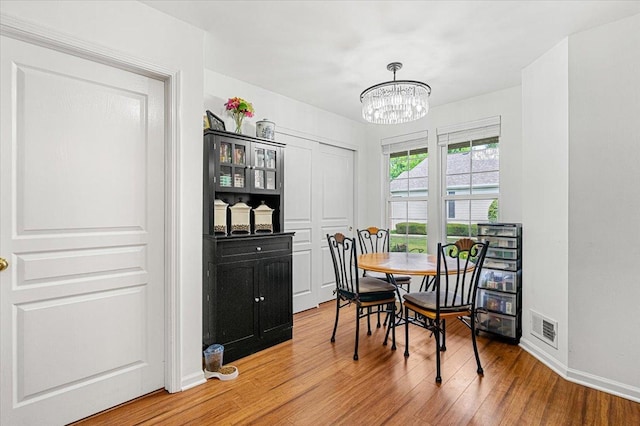 93 W Essington Dr Unit 93, Round Lake, IL 60073 - dining room with a chandelier and wood finished floors