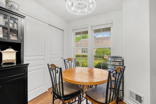 93 W Essington Dr Unit 93, Round Lake, IL 60073 - dining room with a chandelier and light wood-type flooring
