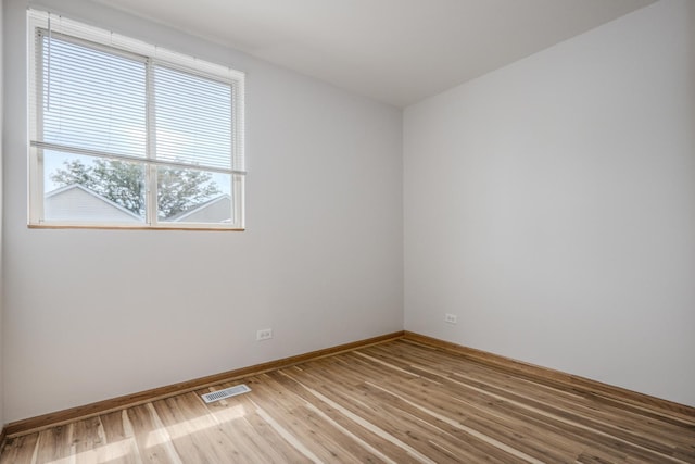 1501 Simms St, Aurora, IL 60504 - spare room featuring light wood-style flooring and baseboards