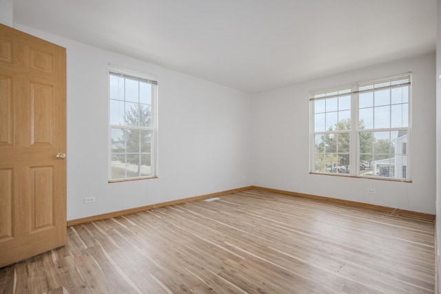 1501 Simms St, Aurora, IL 60504 - empty room featuring light wood-style floors and baseboards