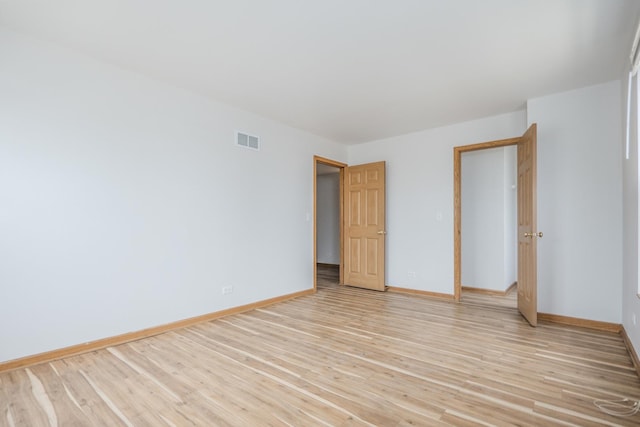 1501 Simms St, Aurora, IL 60504 - unfurnished room featuring baseboards and light wood-style floors
