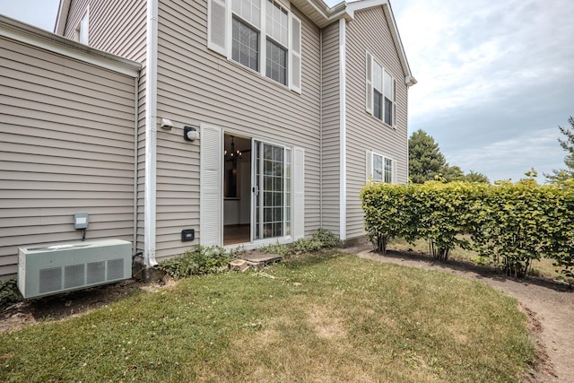 1501 Simms St, Aurora, IL 60504 - view of side of home featuring a central air condition unit and a yard