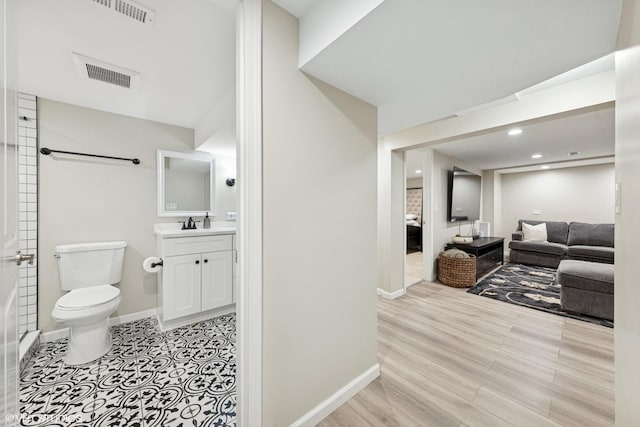588 Glendale Ave, Glen Ellyn, IL 60137 - ensuite bathroom with vanity, wood finished floors, and recessed lighting