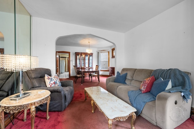 1246 N Monitor Ave, Chicago, IL 60651 - carpeted living room featuring arched walkways and a chandelier