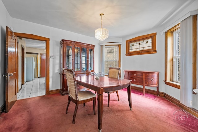 1246 N Monitor Ave, Chicago, IL 60651 - dining space featuring light colored carpet and a chandelier
