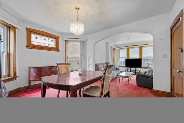 1246 N Monitor Ave, Chicago, IL 60651 - dining area with arched walkways and a chandelier