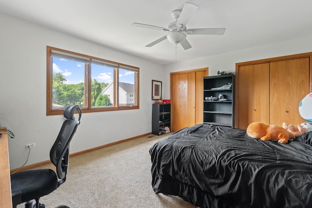 2301 Kerry Ln, Darien, IL 60561 - bedroom with carpet, two closets, and a ceiling fan