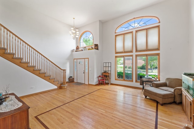 2301 Kerry Ln, Darien, IL 60561 - foyer entrance with wood finished floors, a chandelier, a high ceiling, and stairway