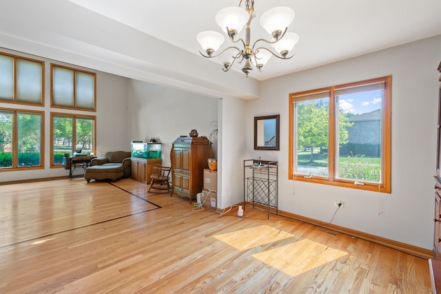 2301 Kerry Ln, Darien, IL 60561 - living area with a chandelier and light wood-style floors