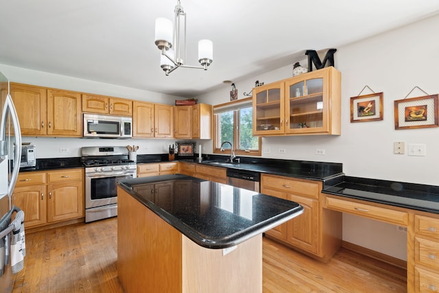 2301 Kerry Ln, Darien, IL 60561 - kitchen with appliances with stainless steel finishes, light wood-style floors, a center island, glass insert cabinets, and decorative light fixtures
