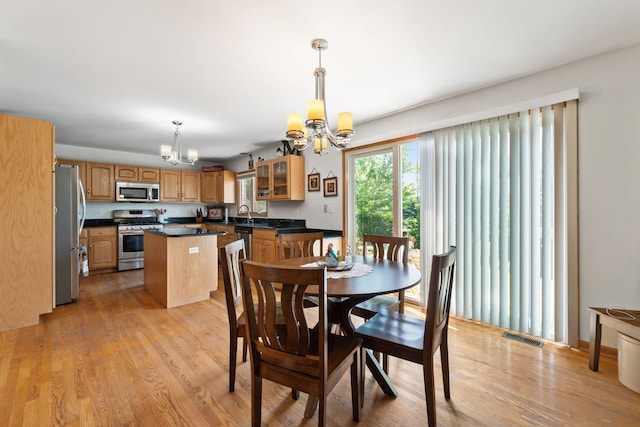 2301 Kerry Ln, Darien, IL 60561 - dining space with a chandelier and light wood-style floors