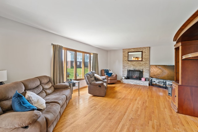 2301 Kerry Ln, Darien, IL 60561 - living area with light wood-style flooring and a fireplace