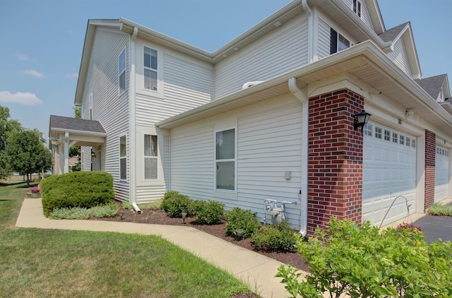 381 Chesapeake Ln, Oswego, IL 60543 - view of side of property with an attached garage