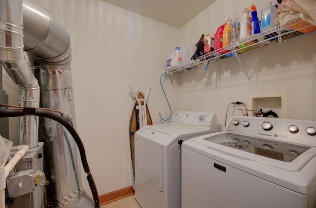 381 Chesapeake Ln, Oswego, IL 60543 - laundry room featuring independent washer and dryer and light tile patterned floors