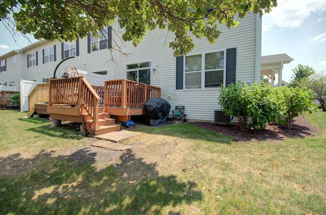 381 Chesapeake Ln, Oswego, IL 60543 - back of property with a lawn and a wooden deck