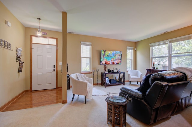 381 Chesapeake Ln, Oswego, IL 60543 - living area with light colored carpet and healthy amount of natural light