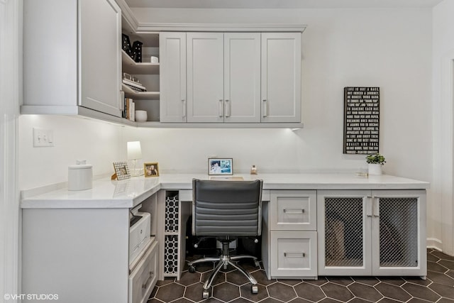 261 Woodstock Ave, Glen Ellyn, IL 60137 - office featuring built in desk and dark tile patterned floors