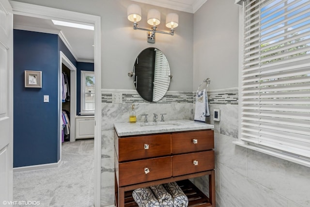 261 Woodstock Ave, Glen Ellyn, IL 60137 - bathroom with ornamental molding, vanity, and tile walls