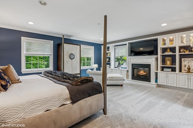 261 Woodstock Ave, Glen Ellyn, IL 60137 - bedroom featuring crown molding, light carpet, a glass covered fireplace, and recessed lighting