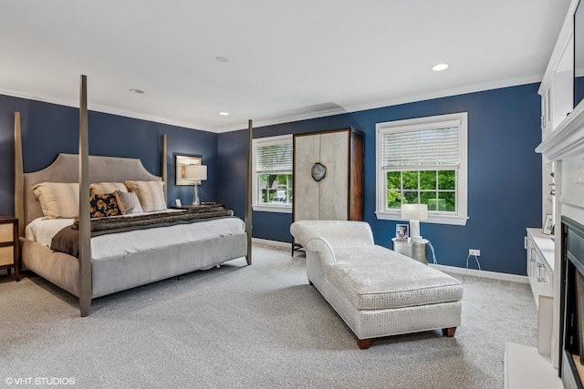 261 Woodstock Ave, Glen Ellyn, IL 60137 - bedroom featuring multiple windows, light colored carpet, a fireplace with flush hearth, ornamental molding, and recessed lighting