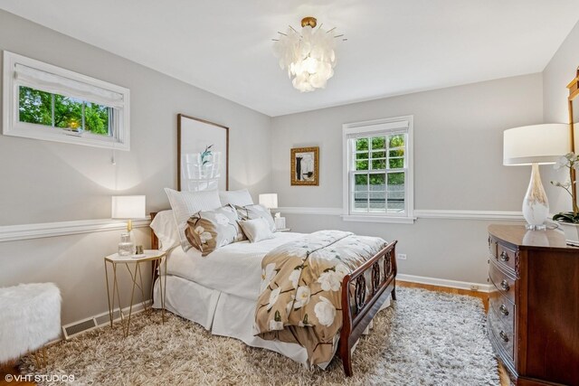 261 Woodstock Ave, Glen Ellyn, IL 60137 - bedroom with a chandelier and wood finished floors