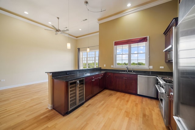 50 N Plum Grove Rd Unit 703E, Palatine, IL 60067 - kitchen featuring high end appliances, beverage cooler, crown molding, light wood finished floors, and a ceiling fan