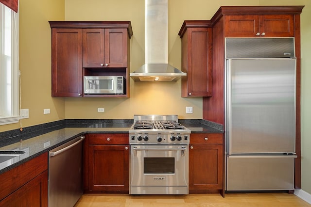 50 N Plum Grove Rd Unit 703E, Palatine, IL 60067 - kitchen with high end appliances, wall chimney range hood, dark stone counters, and light wood finished floors
