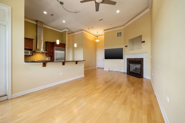 50 N Plum Grove Rd Unit 703E, Palatine, IL 60067 - unfurnished living room with ceiling fan, ornamental molding, light wood-style flooring, a premium fireplace, and recessed lighting