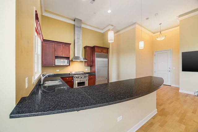 50 N Plum Grove Rd Unit 703E, Palatine, IL 60067 - kitchen with premium appliances, wall chimney exhaust hood, dark countertops, ornamental molding, and a peninsula