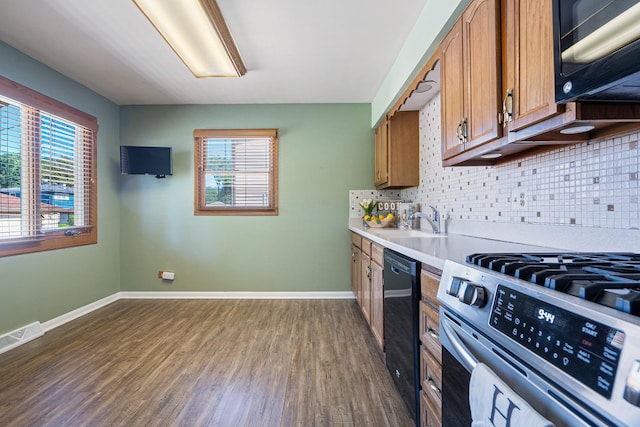 1416 S Chestnut Dr, Mount Prospect, IL 60056 - kitchen featuring black appliances, light countertops, brown cabinetry, dark wood-style floors, and decorative backsplash