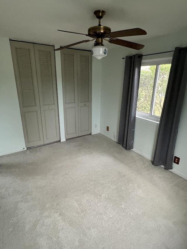 2350 Carnation Dr Unit 4, Crest Hill, IL 60403 - unfurnished bedroom with light colored carpet, multiple closets, and ceiling fan