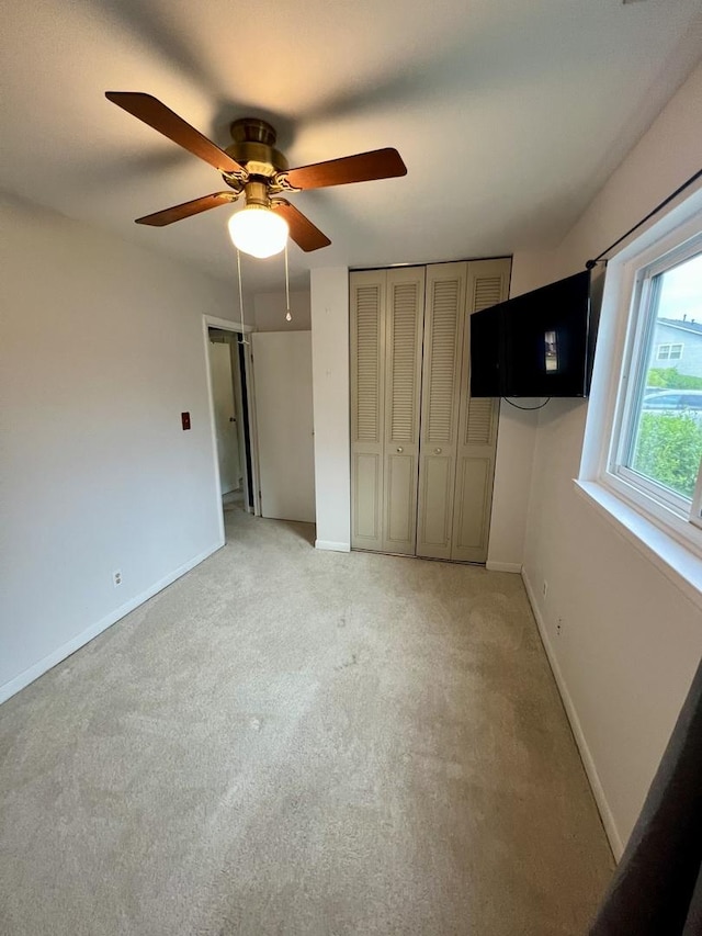 2350 Carnation Dr Unit 4, Crest Hill, IL 60403 - unfurnished bedroom featuring light carpet and a ceiling fan