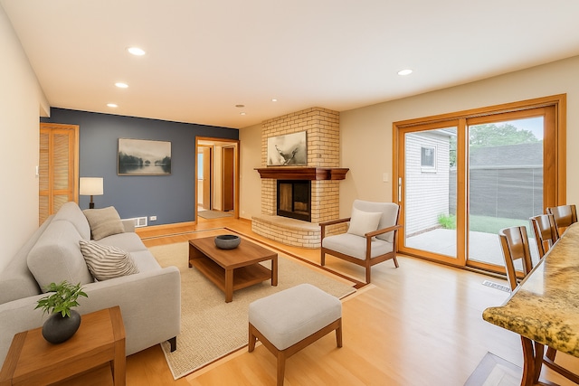 835 Tomawadee Ln, Park Ridge, IL 60068 - living room with recessed lighting, light wood-type flooring, and a fireplace