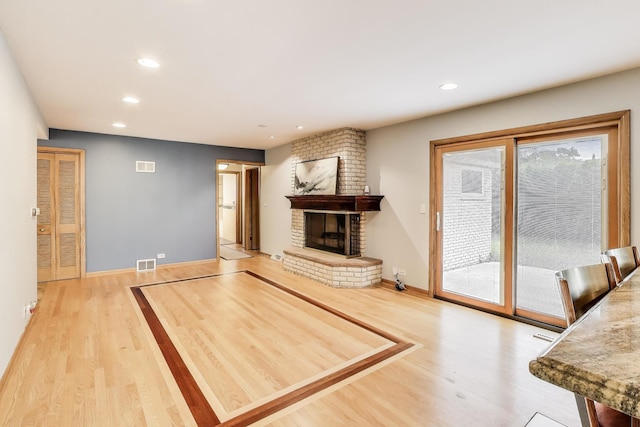 835 Tomawadee Ln, Park Ridge, IL 60068 - living room featuring wood finished floors, a brick fireplace, and recessed lighting