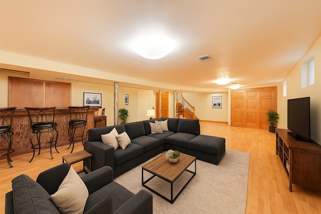 835 Tomawadee Ln, Park Ridge, IL 60068 - living area with light wood-type flooring, stairs, and a dry bar