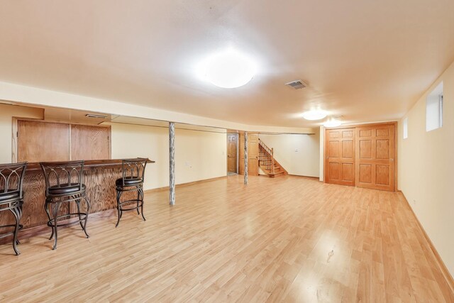 835 Tomawadee Ln, Park Ridge, IL 60068 - finished below grade area with light wood finished floors, a dry bar, and stairs