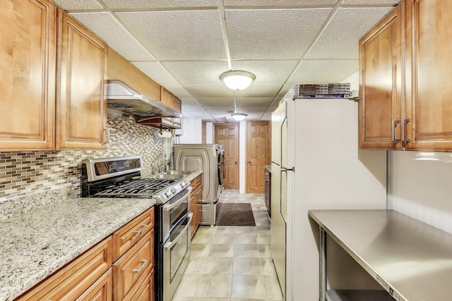835 Tomawadee Ln, Park Ridge, IL 60068 - kitchen with double oven range, ventilation hood, a paneled ceiling, independent washer and dryer, and decorative backsplash