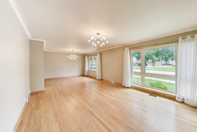 835 Tomawadee Ln, Park Ridge, IL 60068 - spare room featuring a chandelier, ornamental molding, and light wood-style flooring