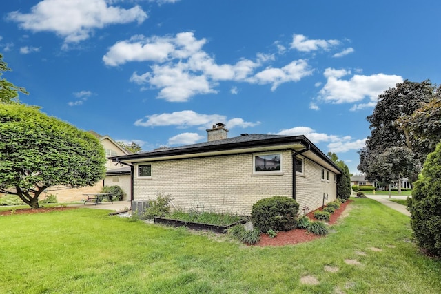 835 Tomawadee Ln, Park Ridge, IL 60068 - view of side of home with brick siding, a lawn, and a chimney