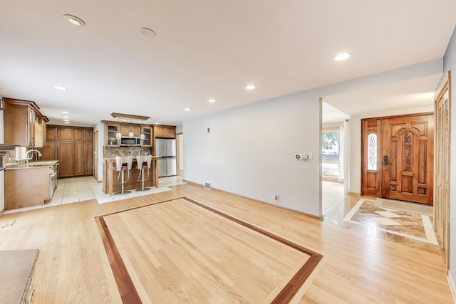 835 Tomawadee Ln, Park Ridge, IL 60068 - unfurnished living room featuring recessed lighting and light wood-type flooring