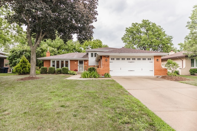 7613 Stratford Pl, Darien, IL 60561 - split level home with a garage, concrete driveway, a chimney, brick siding, and a front lawn