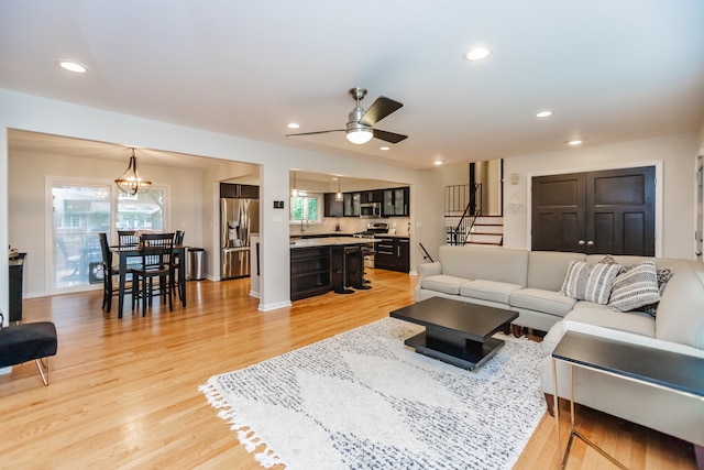 7613 Stratford Pl, Darien, IL 60561 - living area featuring ceiling fan, light wood finished floors, recessed lighting, and stairway