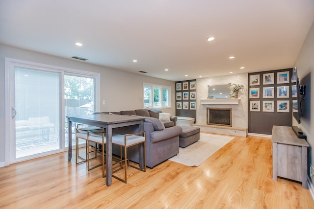 7613 Stratford Pl, Darien, IL 60561 - living area featuring light wood-style flooring, recessed lighting, and a premium fireplace