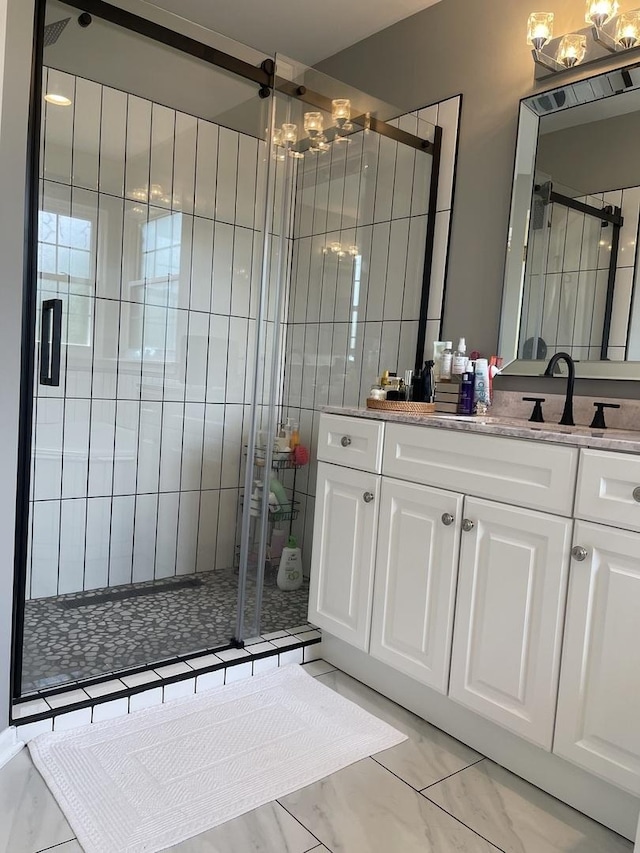 412 Merry Oaks Rd, Streamwood, IL 60107 - bathroom with a chandelier, a stall shower, and vanity