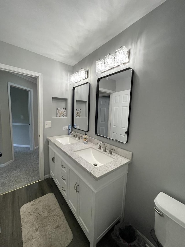 412 Merry Oaks Rd, Streamwood, IL 60107 - bathroom featuring double vanity and wood finished floors