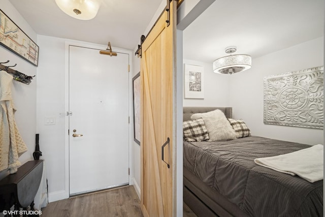 400 E Randolph St Unit 826, Chicago, IL 60601 - bedroom with a barn door and wood finished floors