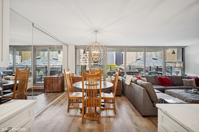 400 E Randolph St Unit 826, Chicago, IL 60601 - dining room with a chandelier, light wood-type flooring, and plenty of natural light