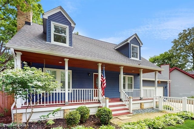 137 Forest Ave, Fox Lake, IL 60020 - cape cod house with a porch, a shingled roof, and a chimney